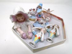 Antique ceramics including a bisque figure of a baby, a pair of china dolly tops,