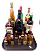 A tray containing six bottles of alcohol together with nine further alcohol miniatures including