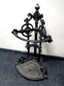 A 19th century cast iron corner stick stand with tray (height 83cm).