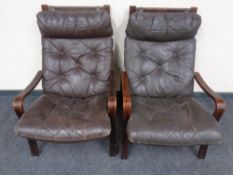 A pair of 20th century Scandinavian stained beech framed armchairs with brown buttoned leather
