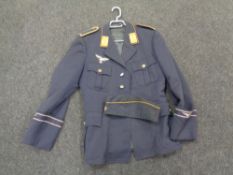 A post-war German tunic with earlier Luftwaffe badge sewn to breast