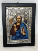 A religious icon with sterling silver overlay decoration, 19.5 cm x 26 cm.
