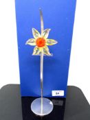 A Swarovski crystal ornament, Paradise Flower Dacali light topaz.