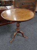 A 19th century mahogany circular pedestal occasional table.