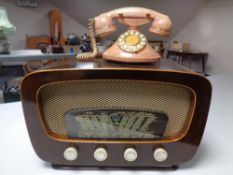 An Art Deco Merkur valve radio together with a retro style telephone.