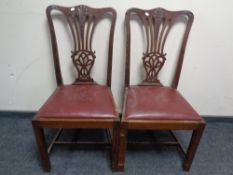 A pair of Edwardian mahogany dining chairs.