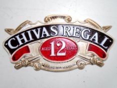 A cast iron wall plaque, Chivas Regal.