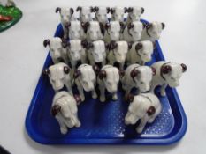 A collection of 22 cast iron figures, Nipper the dog.