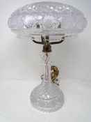 A vintage cut glass table lamp with shade.