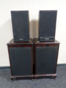 A pair of inlaid mahogany effect speaker cabinets together with a pair of Panasonic speakers.