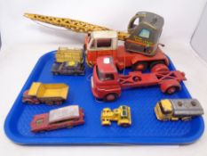 A tray containing mid-20th century play-worn tin plate and die cast vehicles including a 20 ton