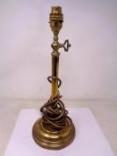 An antique brass lamp base (converted to electricity).