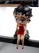 A cast iron figure, Betty Boop, with microphone.