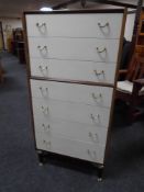 A mid-20th century G-plan two-tone seven drawer chest.