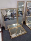 A gilt framed hall mirror together with two further bevel edged wall mirrors in gilt frames.