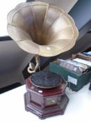 A HMV tabletop gramophone with brass horn.