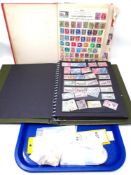 Two stamp albums containing antique and later world stamps,