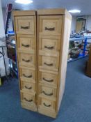 A pair of narrow pine six drawer filing chests