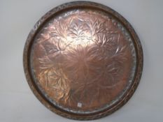 A 19th century embossed copper tray.