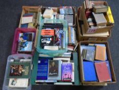 A pallet of hardback and soft backed books, phrase books,