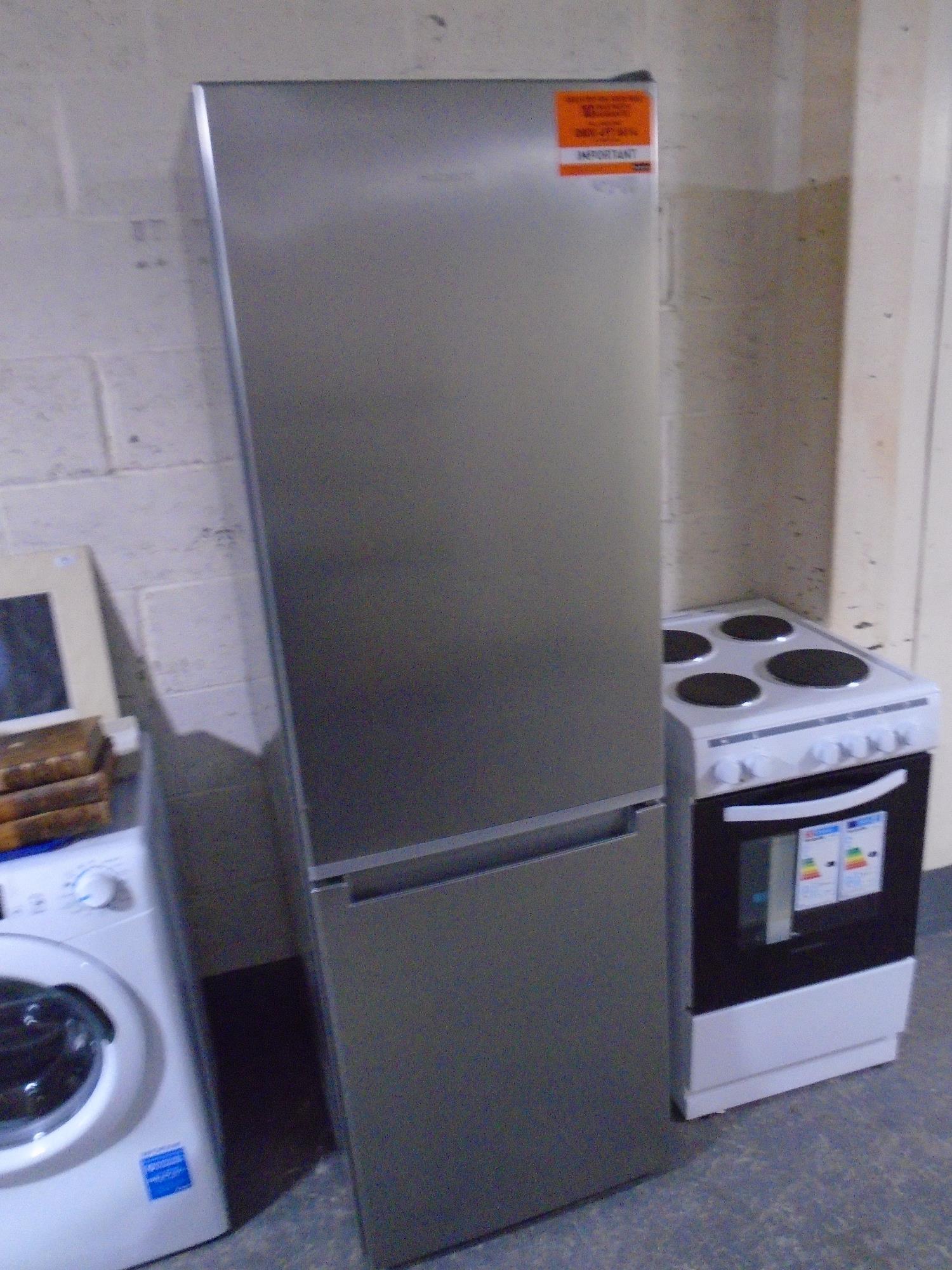 A Hotpoint upright fridge freezer (stainless steel).