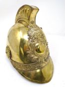 A 19th century French brass fireman's helmet.