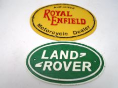 Two cast iron plaques, Royal Enfield motorcycle dealer and Land Rover.