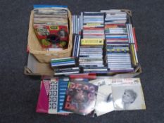 A box containing assorted CDs including The Beatles, compilations,