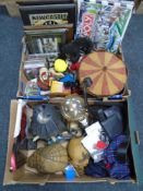 Two crates containing skulls, CDs, Newcastle United prints and monopoly, carousel, gollies etc.