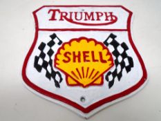 A cast iron plaque, Triumph Shell.