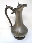 A 19th century pewter wine jug.