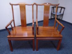 A pair of Chinese elm armchairs