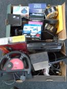 Two boxes containing assorted electricals including DVD player, Gamester computer steering wheel,