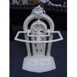 A Victorian painted cast iron stick stand with lift out tray