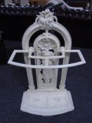 A Victorian painted cast iron stick stand with lift out tray