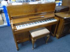 A walnut cased overstrung piano by Squire and Longsone together with storage piano stool