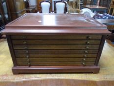A seven drawer counter top coin collector's chest