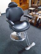 A hydraulic barber's armchair with footrest