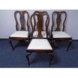 A set of four walnut Queen Anne style dining chairs
