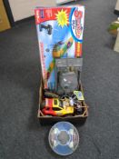 A box containing assorted remote control toys including tank, Spitfire airplane etc.