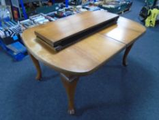 A 19th century mahogany wind-out dining table