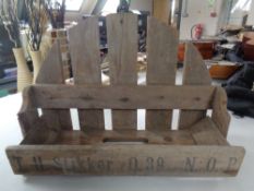 A small rustic pine wall rack