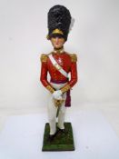 A porcelain figure of an Officer of the Grenadier Guards.