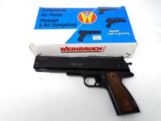 A Weihrauch Sport HW45 .177 calibre air pistol (boxed), together with a tin of Spitfire pellets.
