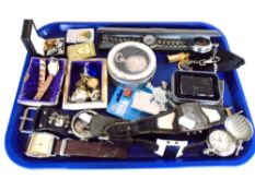 A tray containing assorted Zippo style lighters, costume jewellery, wristwatches,