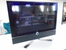 A Loewe individual 32" LCD TV with universal remote (continental wiring).