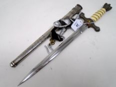 A German Third Reich Kreigsmarine officer's dagger, with unmarked double fullered 25cm long blade,
