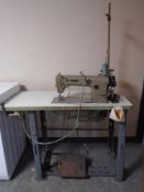 A Brother DB2-B755-3 industrial sewing machine in table.