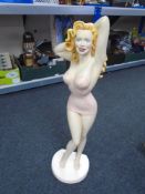 A floor standing figure of a corseted lady,