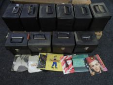 Eight cases containing vinyl 7" singles including Queen, dance music, Motorhead, Rod Stewart,